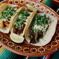 Taco(homemade tortillas) · Choice of meat, cilantro and onions.