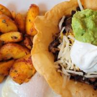 8. Huevos Rancheros · Served with country potatoes, two eggs any style, and your choice of toast or pancakes. cris...