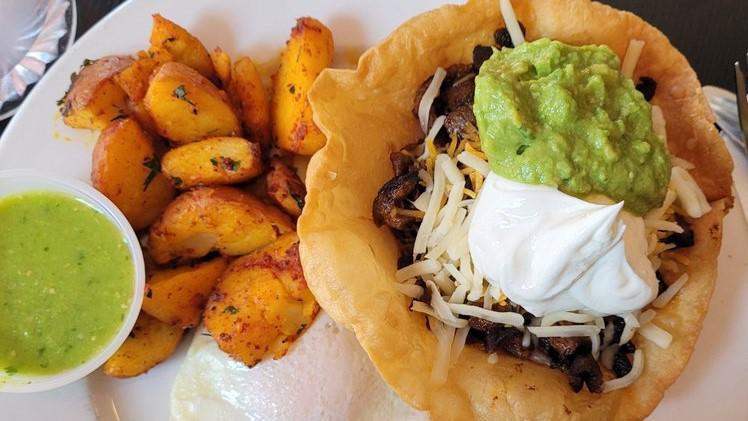 8. Huevos Rancheros · Served with country potatoes, two eggs any style, and your choice of toast or pancakes. crispy small flour shell filled with marinated pork or steak, refried beans, and topped with shredded cheese, sour cream, and guacamole.