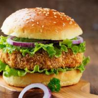 Krispy Chicken Sandwich · Golden fried chicken topped with fresh lettuce, tomato, and mayo on a soft bun.