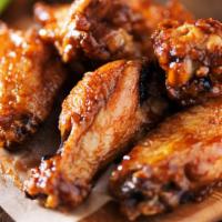 Sweet BBQ Fried Chicken Wings · Golden-crispy fried chicken wings dipped in sweet BBQ sauce.