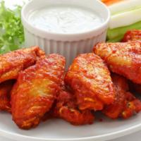 Buffalo Chicken Wings · Deep fried well seasoned crispy wings tossed in a zingy buffalo sauce. Comes with your choic...