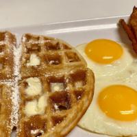 Belgian Waffle Deluxe · Homemade Belgian waffle with choice of meat and two eggs.