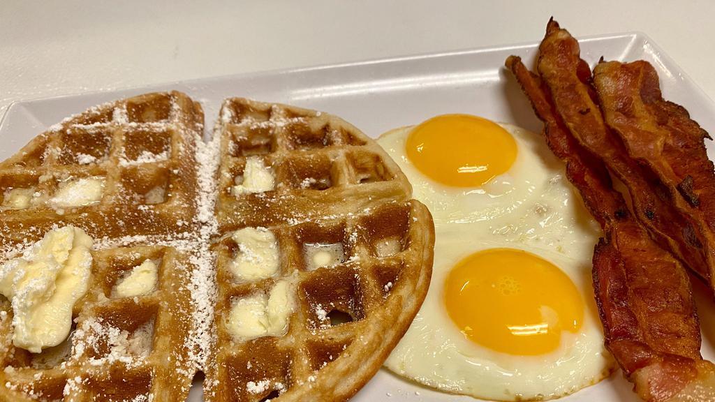 Belgian Waffle Deluxe · Homemade Belgian waffle with choice of meat and two eggs.