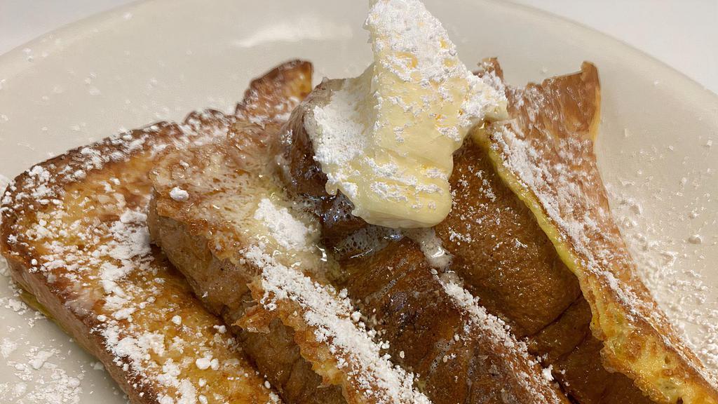 French toast · Served with butter powder sugar and syrup.