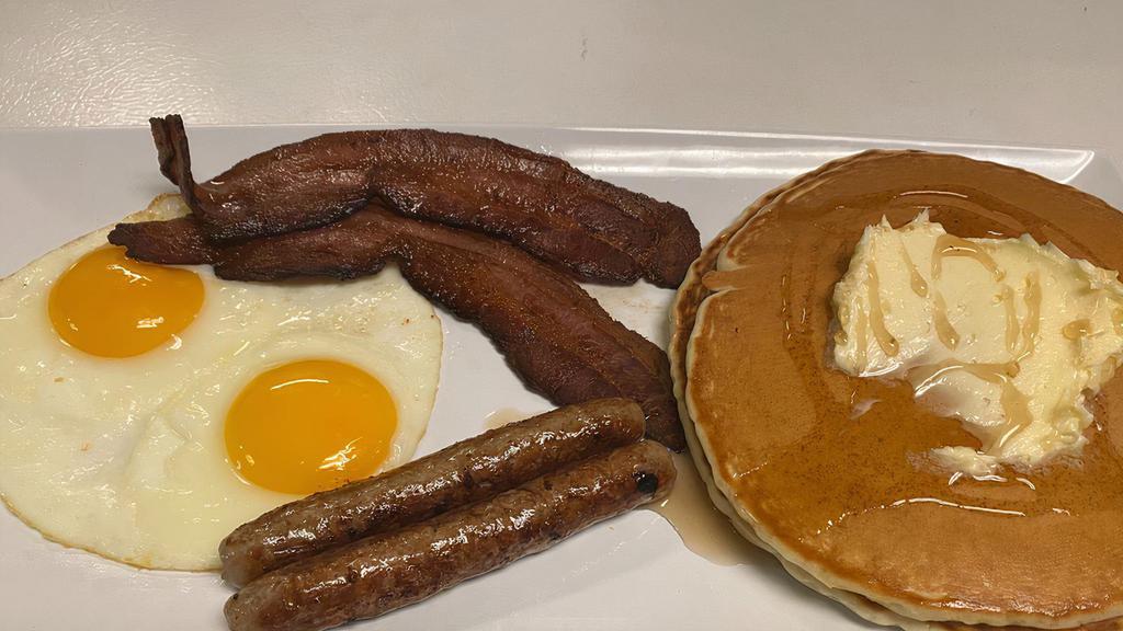 Pancake Deluxe · Two pancakes with choice of meat and two eggs.