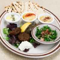 Cold Meze Plate · Hummus, baba ganoush, tabbouleh, tzatziki, 2 dolmas, 2 falafels, (1) hot pita bread.