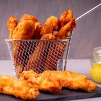 Crispy Chicken Tenders with Tartar Sauce · Customer's choice of Delicious fried Crispy Chicken Tenders, served on a bed of golden crisp...