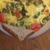 Ultimate French Omelet · Breakfast: This is a customer favorite!!! Three eggs with Roma tomatoes, fresh spinach, onio...