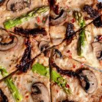 Creamy Mushroom Pizza · Creamy almond sauce, shredded mozzarella, mushrooms, asparagus and sun-dried tomatoes, garni...