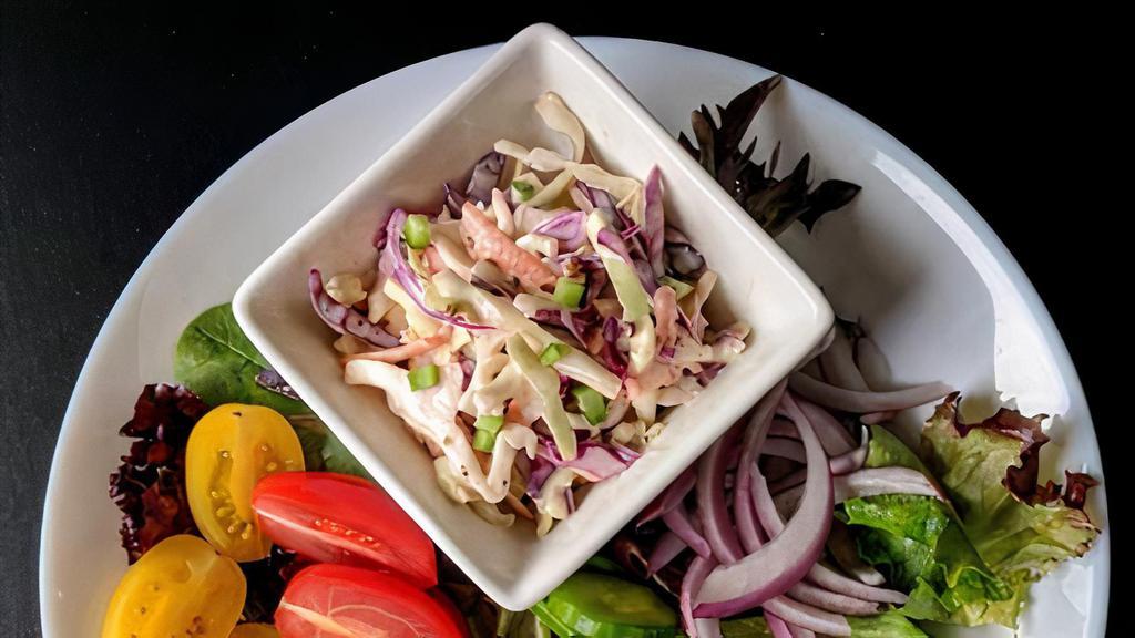Cucumber salad · Tomatoes, cucumber, red onions with salad greens and coleslaw