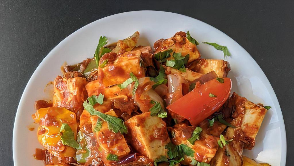 Paneer Tikka · Cottage cheese cubes (paneer) with onions and peppers in a spiced tomato glaze.