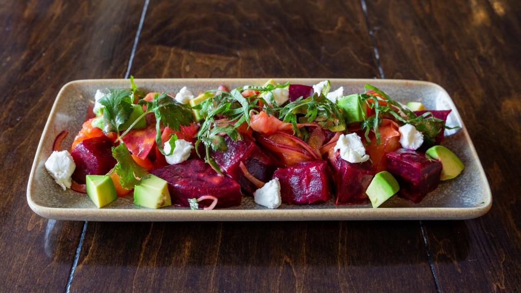 Beet Salad · Golden and red beets | watermelon radishes | shaved fennel | cilantro | avocado | fresh goat cheese | . chipotle dressing