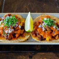 Al Pastor · Achiote marinated and spit roasted pork | caramelized pineapple salsa | onion | cilantro