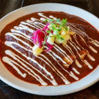 Enchiladas De Pollo · Roasted chicken | mole sauce | apple | queso Oaxaca | almonds | crema