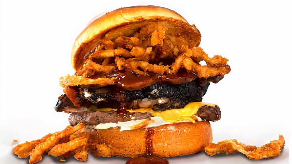 The Nunchuck Norris Cheeseburger · A  cheeseburger served on a toasted brioche bun, topped with smoked brisket, sliced polish sausage, crispy onion tanglers, barbecue sauce, and mayo.