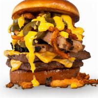 El Fuego Burger · A double burger served on a toasted brioche bun, topped with smoked brisket, spicy jalapeno ...