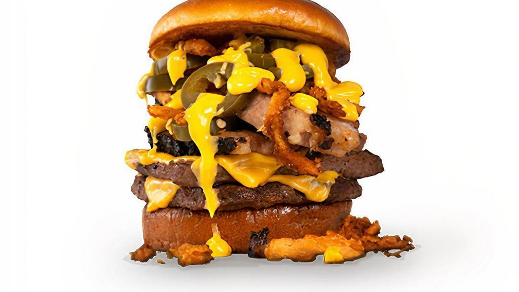 El Fuego Burger · A double burger served on a toasted brioche bun, topped with smoked brisket, spicy jalapeno cheese sauce, pickled jalapenos, and crispy onion tanglers.