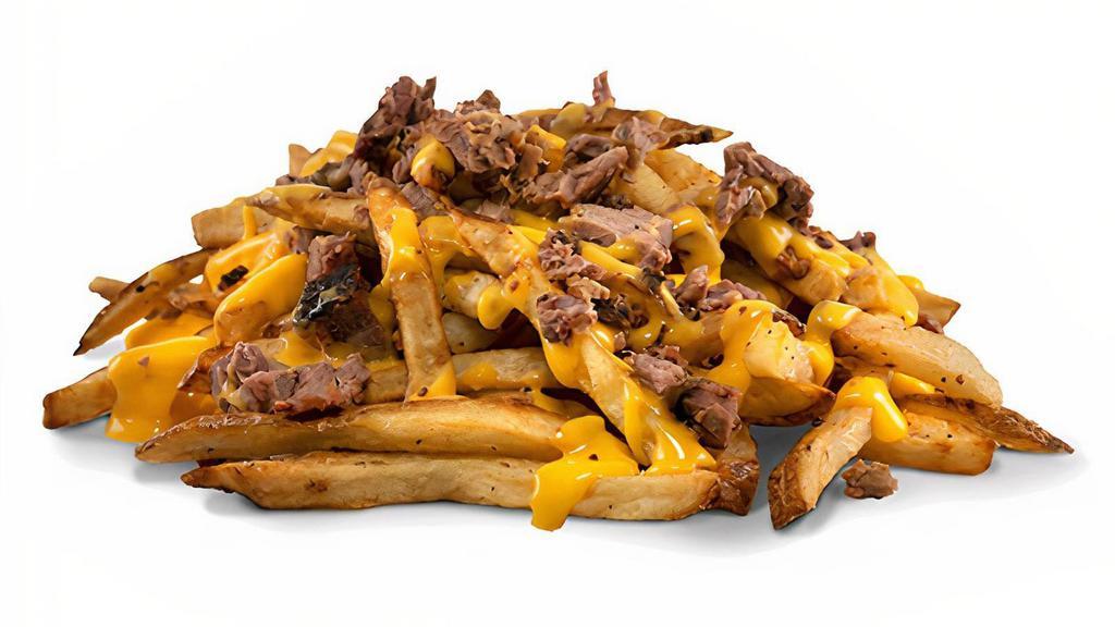 Brisket Cheese Fries · Hand cut fries smothered with jalapeño cheese sauce, topped with smoked chopped brisket
