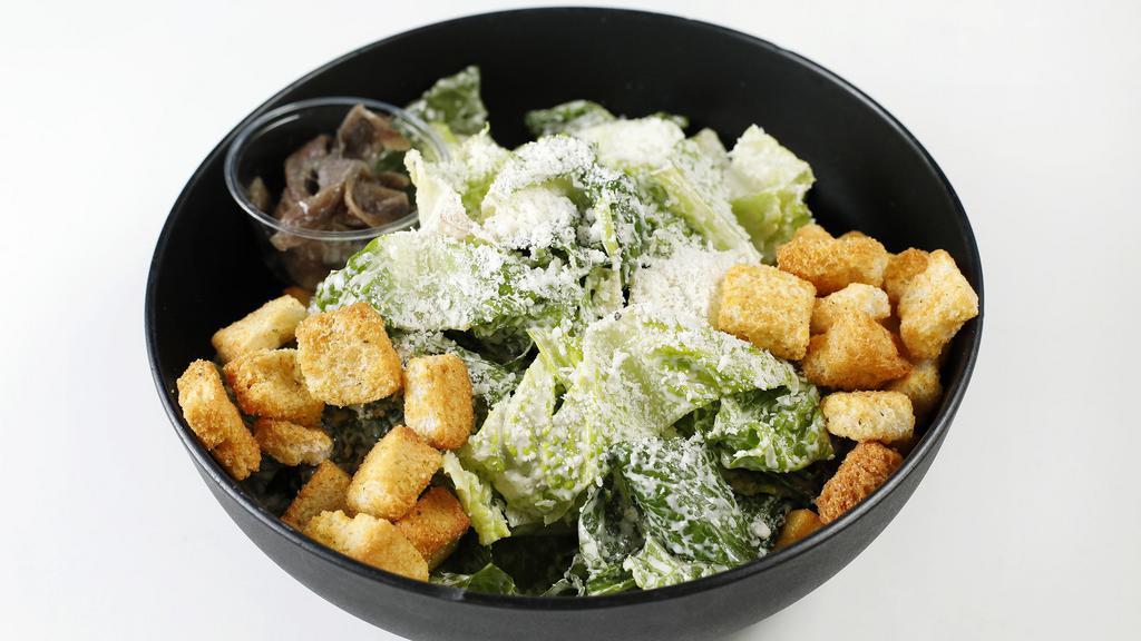 Supreme Caesar Salad · Romaine Heart, Caesar Dressing, Grated Parmesan Cheese, Croutons and Anchovies.