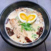Tonkotsu Ramen · Warming and rich dish made with ramen noodles, Chashu, sesame and green onion