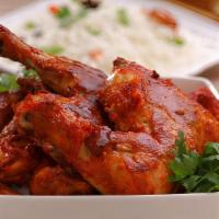 Full Tandoori Chicken · 2 leg and 2 breast pieces marinated in traditional spices then baked in a tandoor clay oven;...