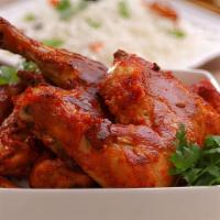 Half Tandoori Chicken · 1 leg and 1 breast piece marinated in traditional spices then baked in a tandoor clay oven; ...