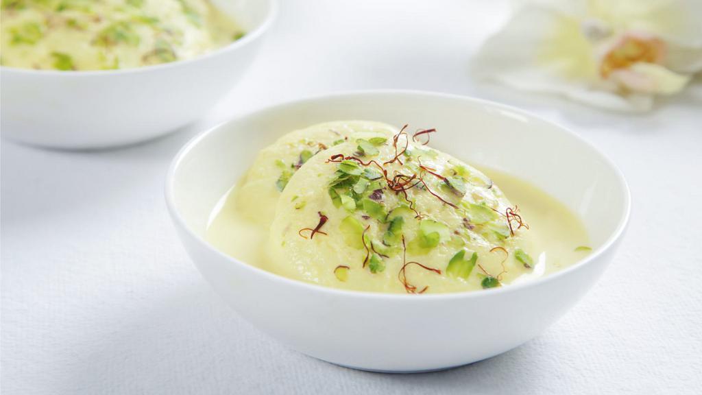 Ras Malai · Classic ras malai made with nuts and soaked in saffron flavored milk.