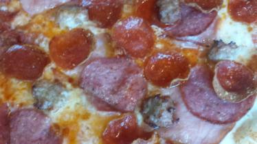 Meat Lovers Combo Pizza (X-Large) · Canadian bacon, pepperoni, salami, and Italian sausage.