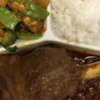 Lamb Shank · A juicy and tender lamb shank marinated in herbs and spices, cooked in a savory red curry. S...