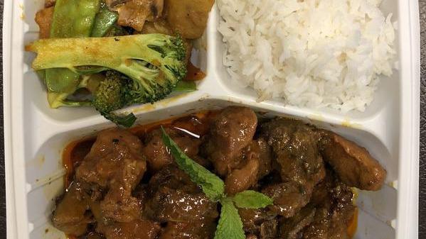 Mango Chutney Pork Stew · A bold, tangy and sweet mango chutney combined with soft juicy pork mixed with spices to give the dish a kick. Served with rice and stir fried vegetables.