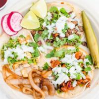 Taco · Meat, cilantro, onion.