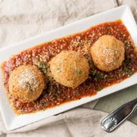 Arrancini · With mozzarella cheese. Served in meat ragu sauce.