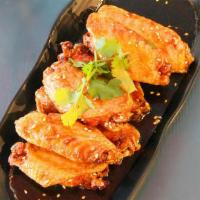 Fire Chicken Wings 火焰鸡翅 · Fried chicken wing with housemade sauce. (7pc) Sweet n' hot n' sour flavor