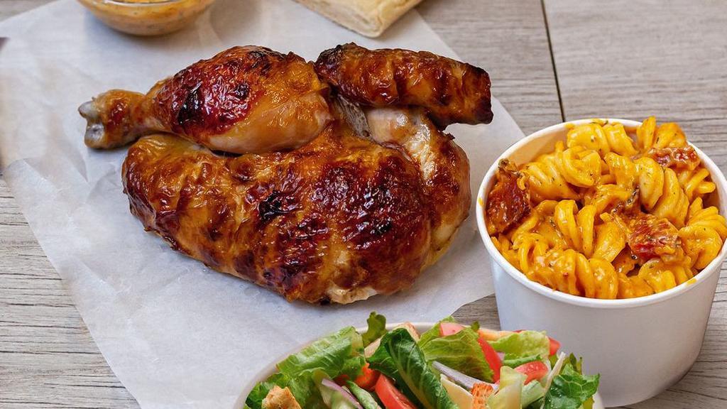 Half Rotisserie Chicken Meal · Served with your choice of sauce, 1 side, a Caesar salad and artisan bread
