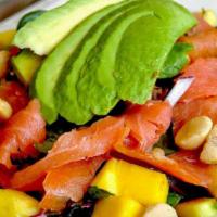 Gauguin Salad · Spring mix tossed with raspberry balsamic and served with mangoes, macadamia nuts, avocado, ...