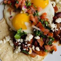 Huevos Rancheros · 2 eggs your way on 2 corn tortillas, with black beans , pico de gallo, feta cheese, and home...