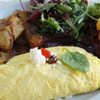 The Benaki Omelet · Three egg omelette with feta cheese, tomato, green onion, kalamata olives and spinach served...