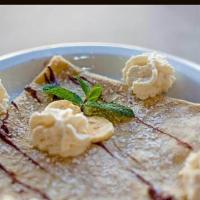 Magritte · Nutella and banana crepe.