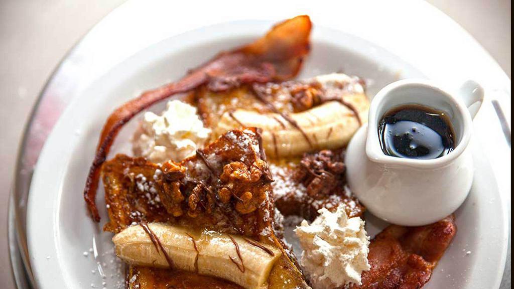 Belvedere (French Toast) · Bananas Foster rum french toast, topped Nutella and bacon.