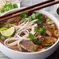 23. House Noodle Soup · Savory light broth with noodles.