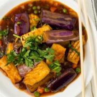 Eggplant Tofu · Organic tofu, eggplant, peas, carrot & cilantro simmered in Szechuan sauce