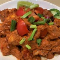 Thai Red Curry · Tofu, sweet potato, tomato, and red bell pepper in red curry sauce, served with steamed brow...