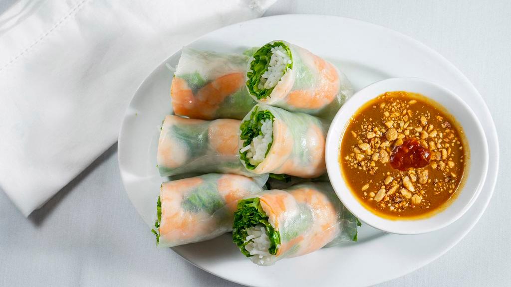 Shrimp Rolls (3) · Steamed prawns, rice vermicelli, mint leaves, lettuce, wrapped in rice paper and served with peanut sauce.
