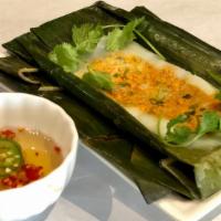 Bánh Nậm (3) · Three shrimp and pork rice cakes wrapped in banana leaves.