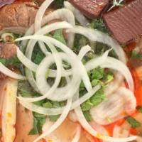 Bún Bò Huế · Spicy beef noodle soup with beef, pork, pork blood, Vietnamese ham, and tendon. Có thịt bò, ...
