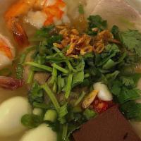 Bánh Canh · Udon noodles with Vietnamese ham, pork belly, pork knuckle, pork blood, shrimp, and quail eg...