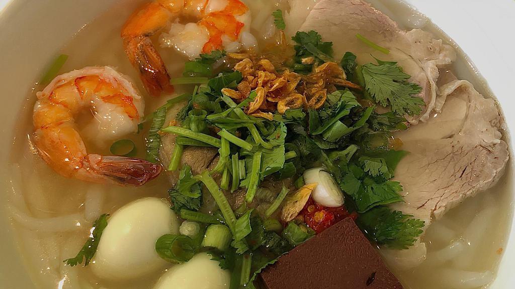 Bánh Canh · Udon noodles with Vietnamese ham, pork belly, pork knuckle, pork blood, shrimp, and quail eggs.