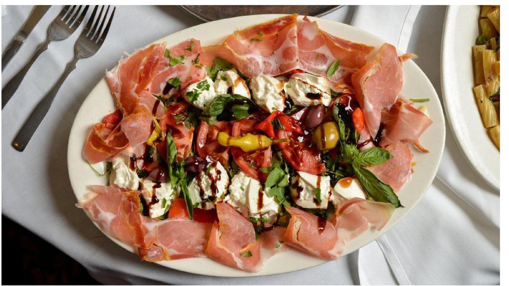 Antipasto Italiano · Platter of Cured imported Italian Meats & Cheeses, Assorted Grilled Vegetables and Black Olives, finished with a Balsamic-glace drizzle