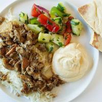 9. Chicken Shawarma Plate · Tender marinated and seasoned chicken breast slowly roasted, shaved thinly, and served with ...